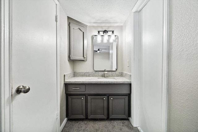 bathroom featuring vanity and a textured ceiling