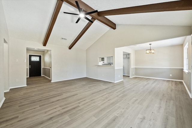 unfurnished living room with light hardwood / wood-style flooring, lofted ceiling with beams, and ceiling fan with notable chandelier