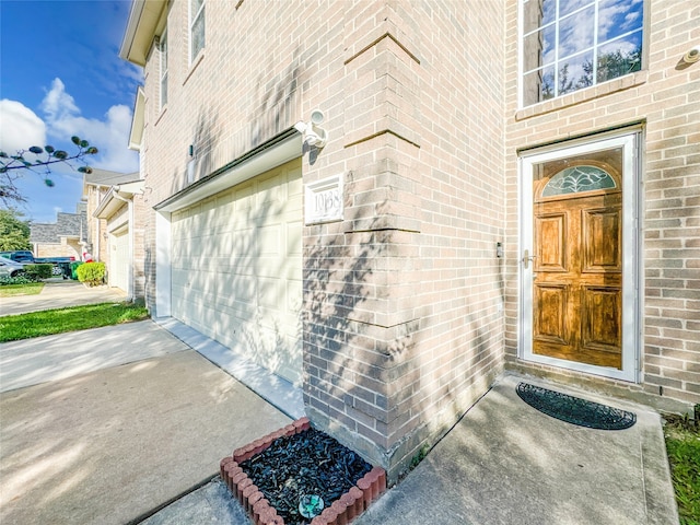 view of exterior entry featuring a garage