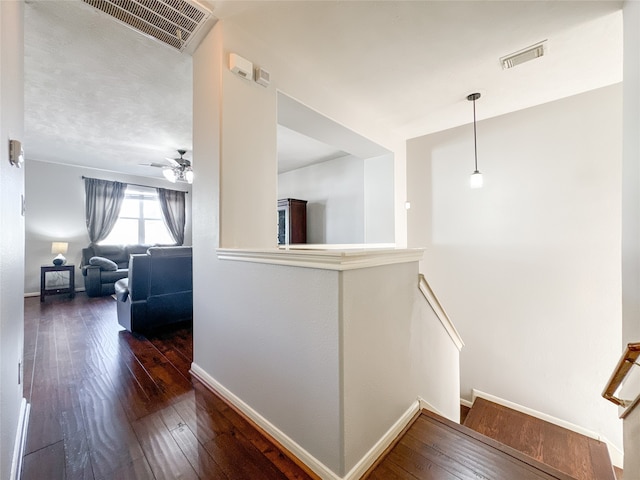 hall with dark wood-type flooring