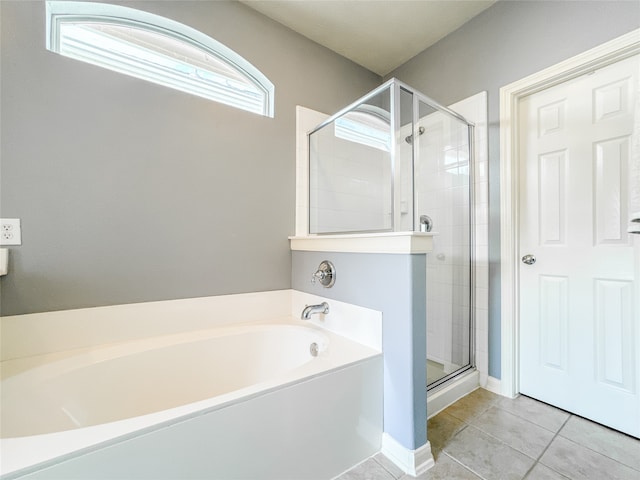 bathroom featuring independent shower and bath and tile patterned floors