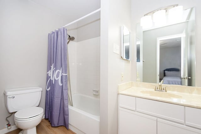 full bathroom featuring vanity, shower / tub combo, wood-type flooring, and toilet