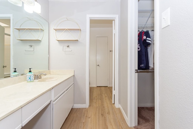 bathroom featuring vanity and hardwood / wood-style flooring