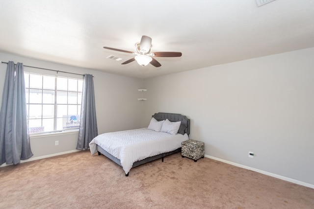 bedroom with light carpet and ceiling fan