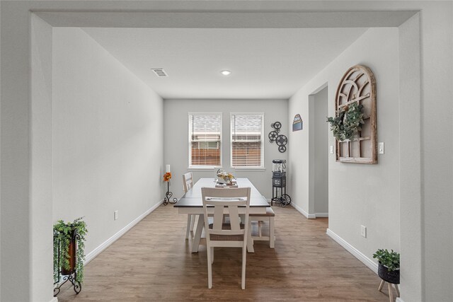 dining area with light hardwood / wood-style floors