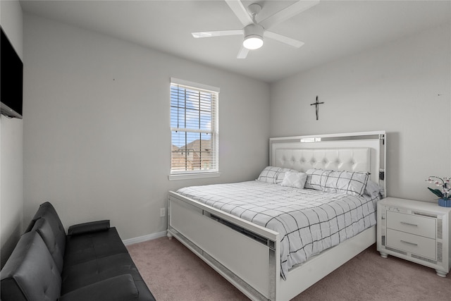 bedroom with light carpet and ceiling fan