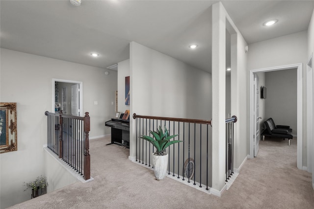 corridor with light colored carpet