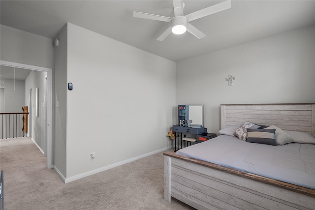 bedroom featuring light carpet and ceiling fan