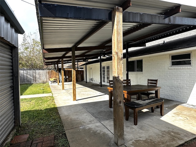 view of patio / terrace featuring ceiling fan and french doors