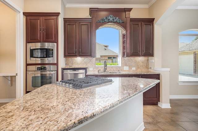 kitchen featuring stainless steel appliances, sink, and plenty of natural light