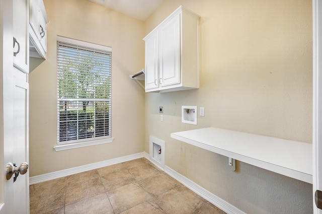 laundry room featuring hookup for an electric dryer, cabinets, and hookup for a washing machine