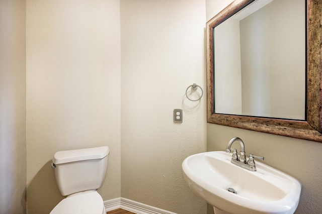 bathroom featuring sink and toilet