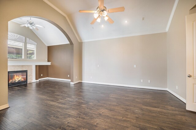 unfurnished living room with crown molding, lofted ceiling, dark hardwood / wood-style floors, and ceiling fan