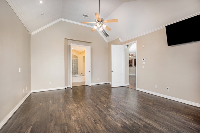 empty room with crown molding, dark hardwood / wood-style floors, ceiling fan, and vaulted ceiling