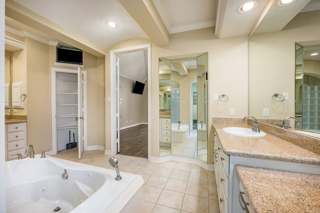 bathroom with vanity, ornamental molding, tiled bath, and tile patterned flooring