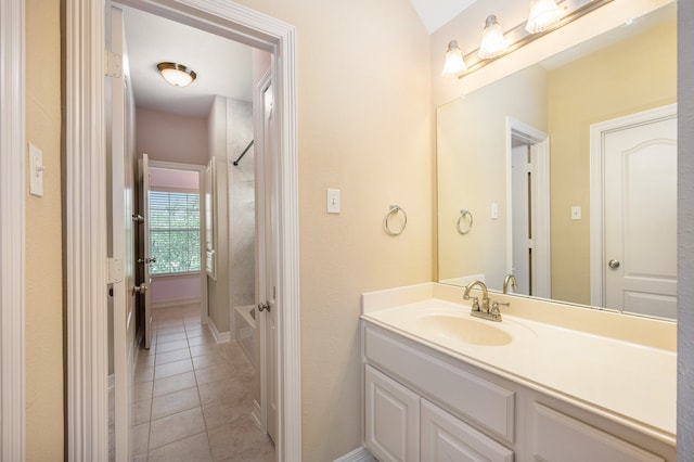 bathroom featuring vanity, shower / tub combination, and tile patterned flooring