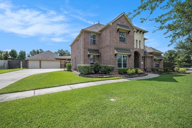 view of front of property featuring a front lawn and a garage