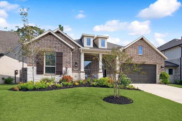 view of front of house with a front yard and a garage