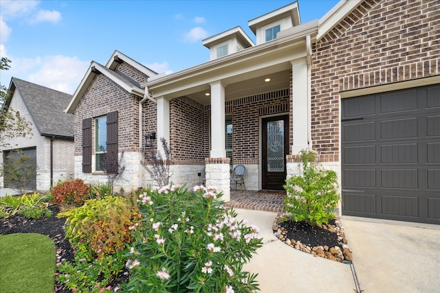 view of front of home with a porch and a garage