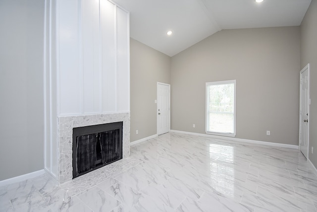 unfurnished living room with lofted ceiling