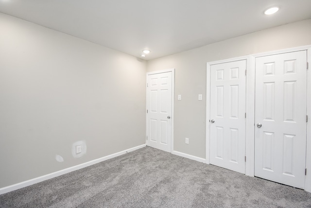 unfurnished bedroom featuring carpet