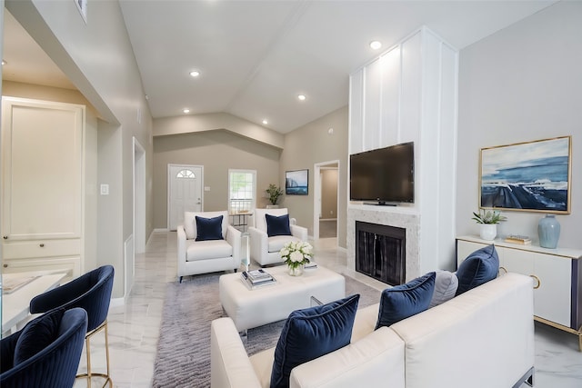 living room featuring lofted ceiling