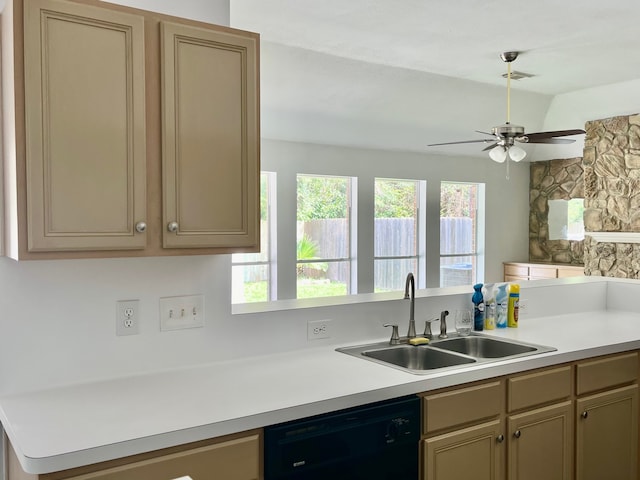 kitchen featuring ceiling fan, dishwasher, lofted ceiling, and sink