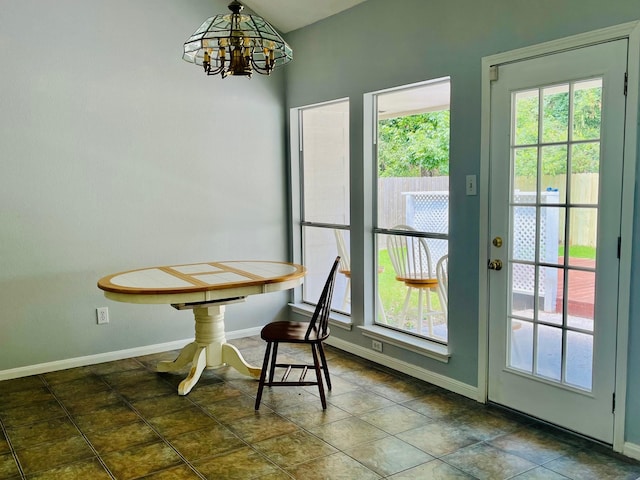 4219 Hermitage Hollow Ln, Kingwood, TX 77339 - dining area featuring a chandelier and baseboards