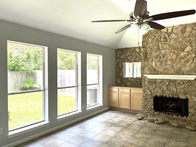 4219 Hermitage Hollow Ln, Kingwood, TX 77339 - unfurnished living room with lofted ceiling, a fireplace, a ceiling fan, and baseboards