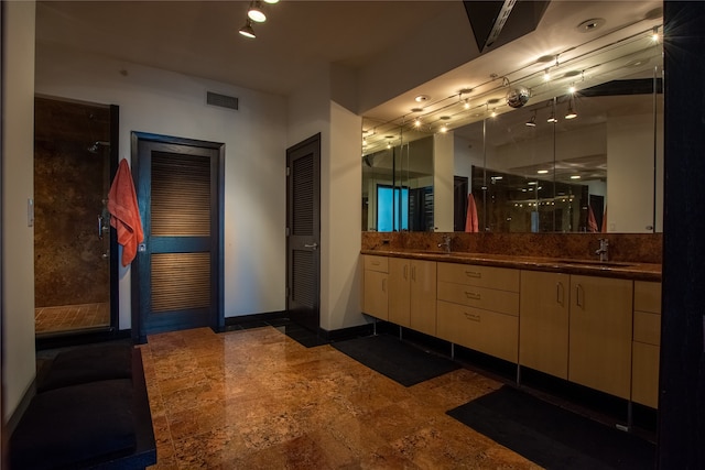 bathroom featuring vanity and an enclosed shower