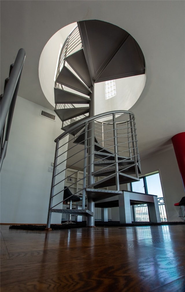 stairway featuring hardwood / wood-style floors