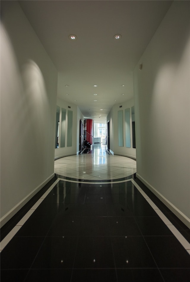 hallway featuring tile patterned floors