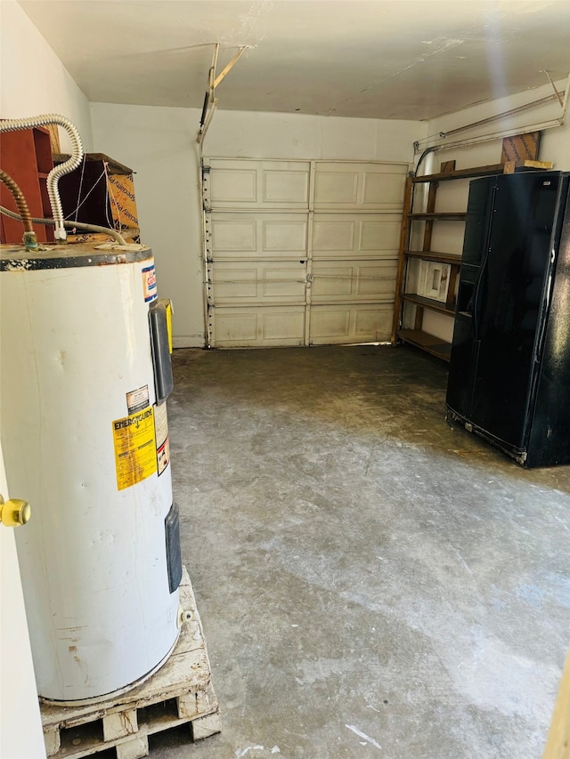 garage with water heater and black refrigerator