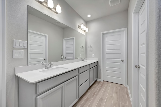 bathroom featuring vanity and hardwood / wood-style flooring