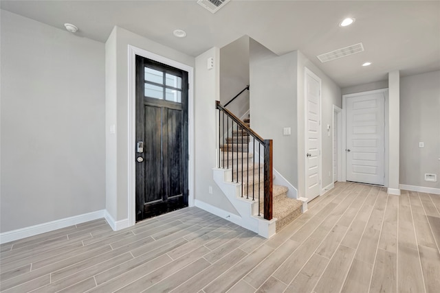 entryway with light hardwood / wood-style floors