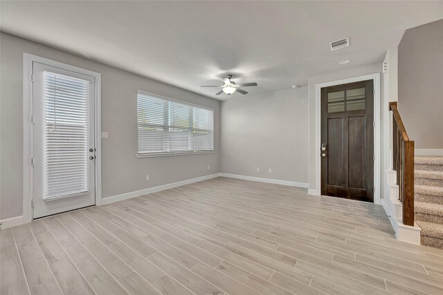 foyer with light wood-type flooring and ceiling fan