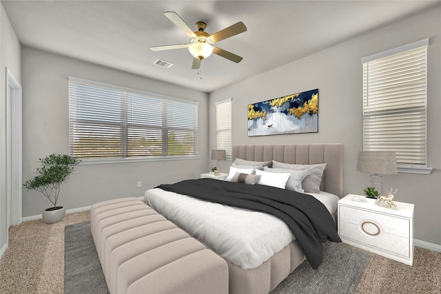 bedroom with ceiling fan and carpet floors