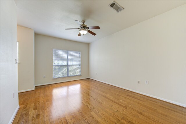 unfurnished room with light hardwood / wood-style floors and ceiling fan