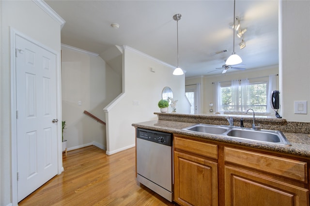 kitchen featuring light hardwood / wood-style flooring, sink, crown molding, decorative light fixtures, and stainless steel dishwasher