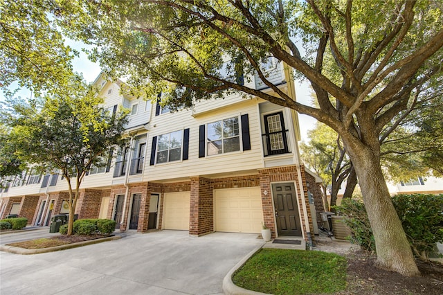 multi unit property featuring a garage