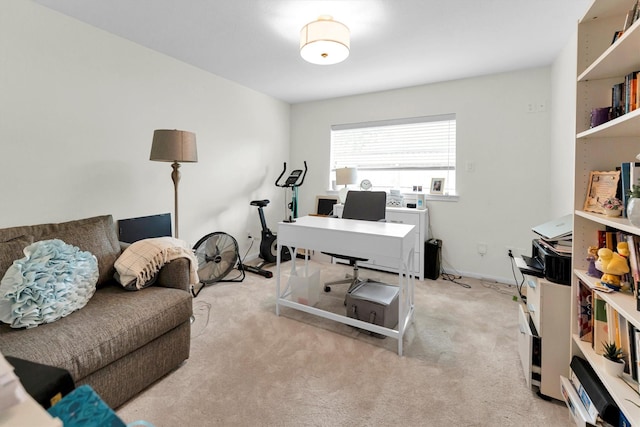 carpeted home office with baseboards