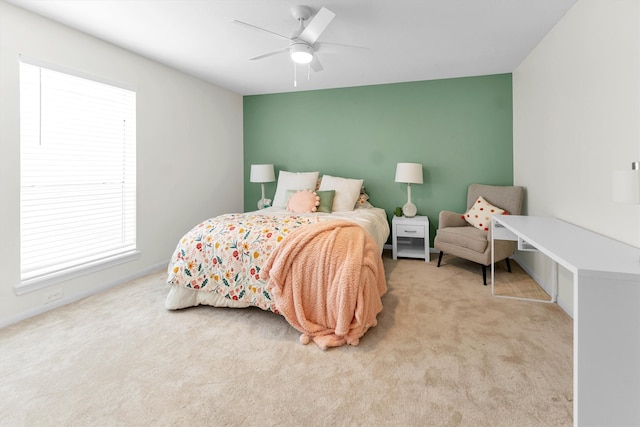 bedroom featuring ceiling fan and light colored carpet