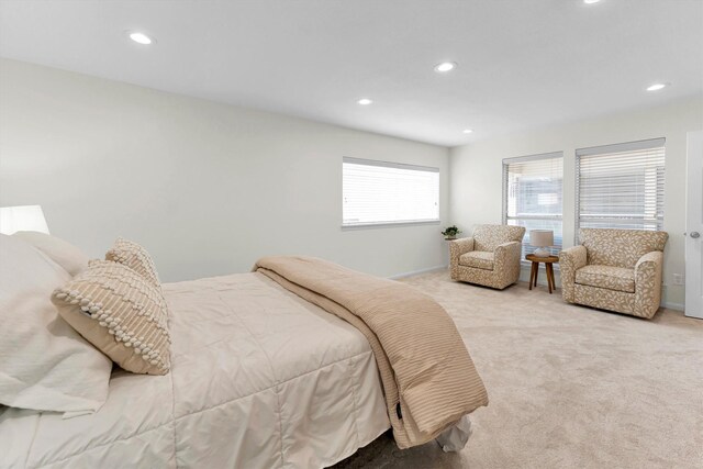 bedroom with baseboards, light carpet, and recessed lighting