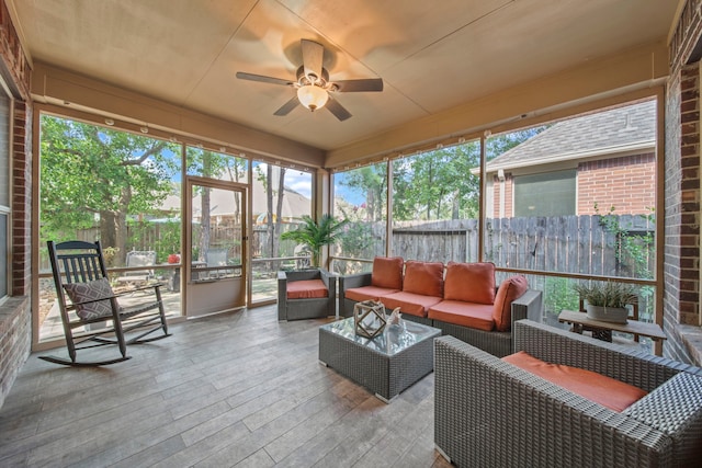 sunroom with ceiling fan