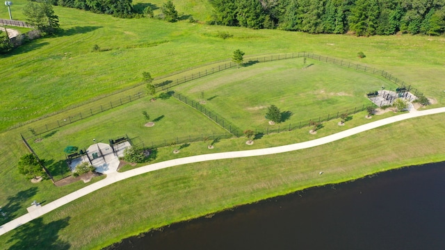 birds eye view of property with a water view and a rural view