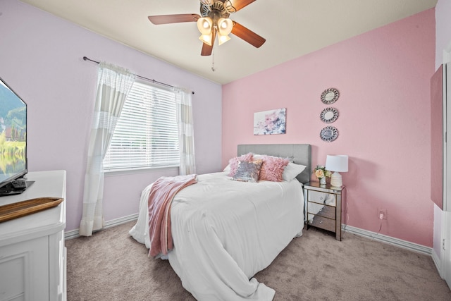 bedroom featuring light colored carpet and ceiling fan