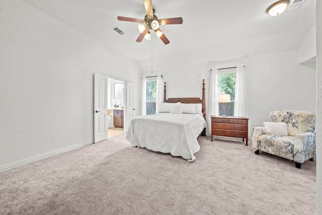 bedroom featuring ceiling fan, vaulted ceiling, multiple windows, and carpet floors