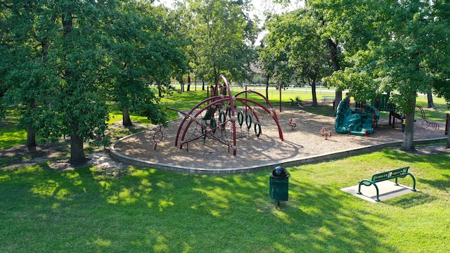 view of jungle gym featuring a lawn