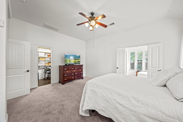 carpeted bedroom with vaulted ceiling and ceiling fan