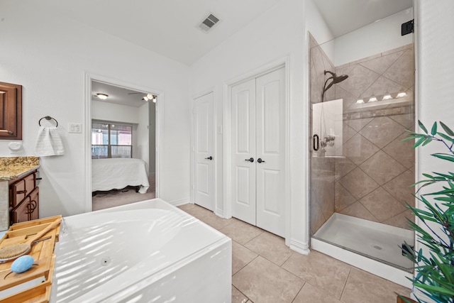 bathroom featuring vanity, tile patterned floors, and independent shower and bath